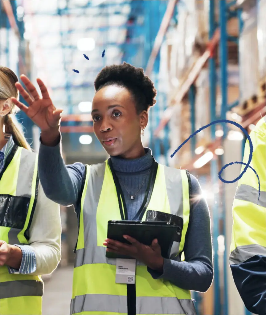 Woman directing a team in a warehouse